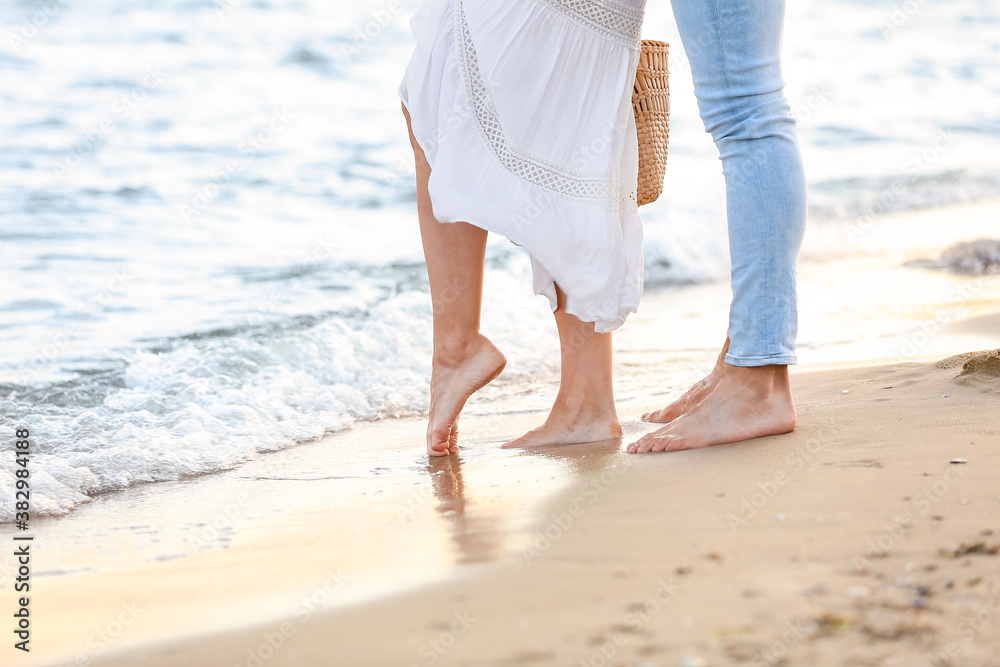 Happy young couple on sea beach