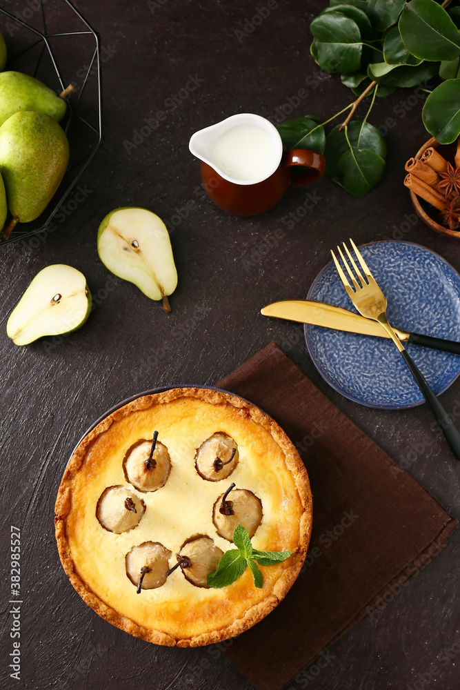 Tasty pear cake on dark background