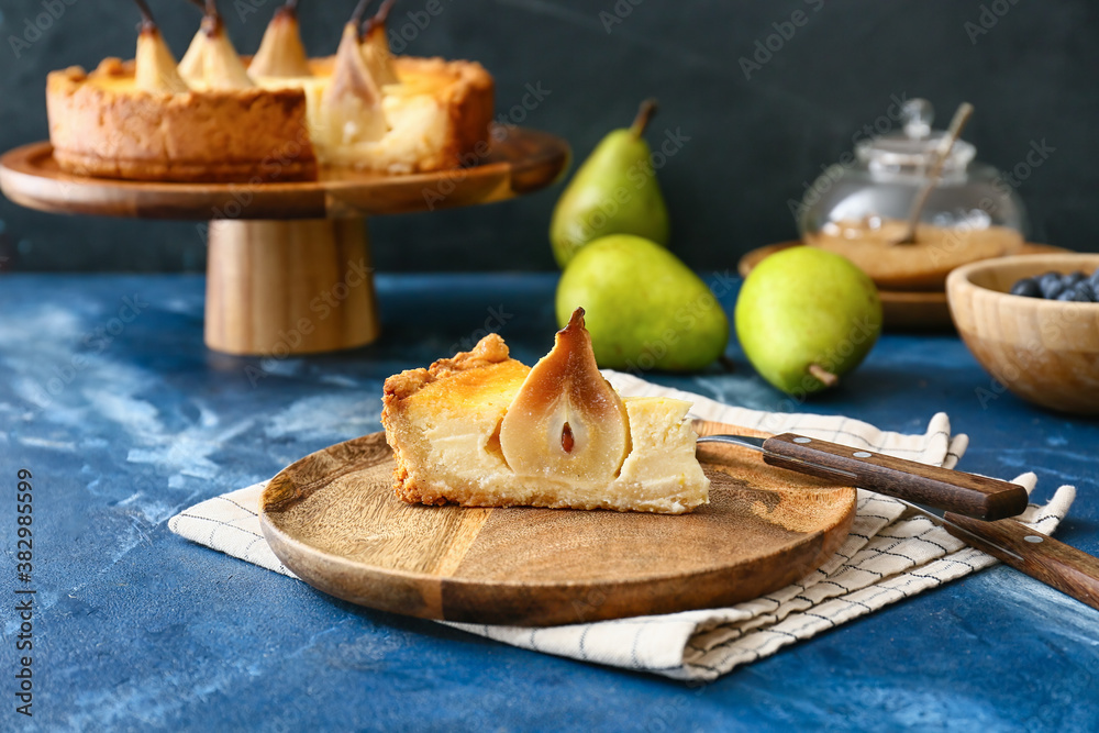 Plate with tasty pear cake on table