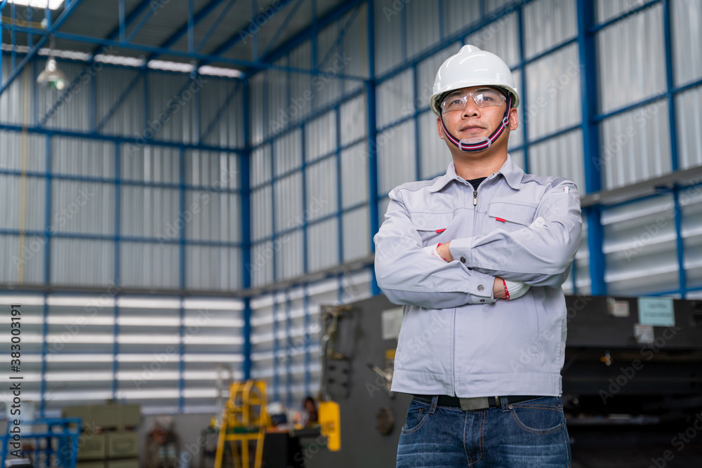 Portrait of manual asian man worker is standing confident with confident with working suite dress an