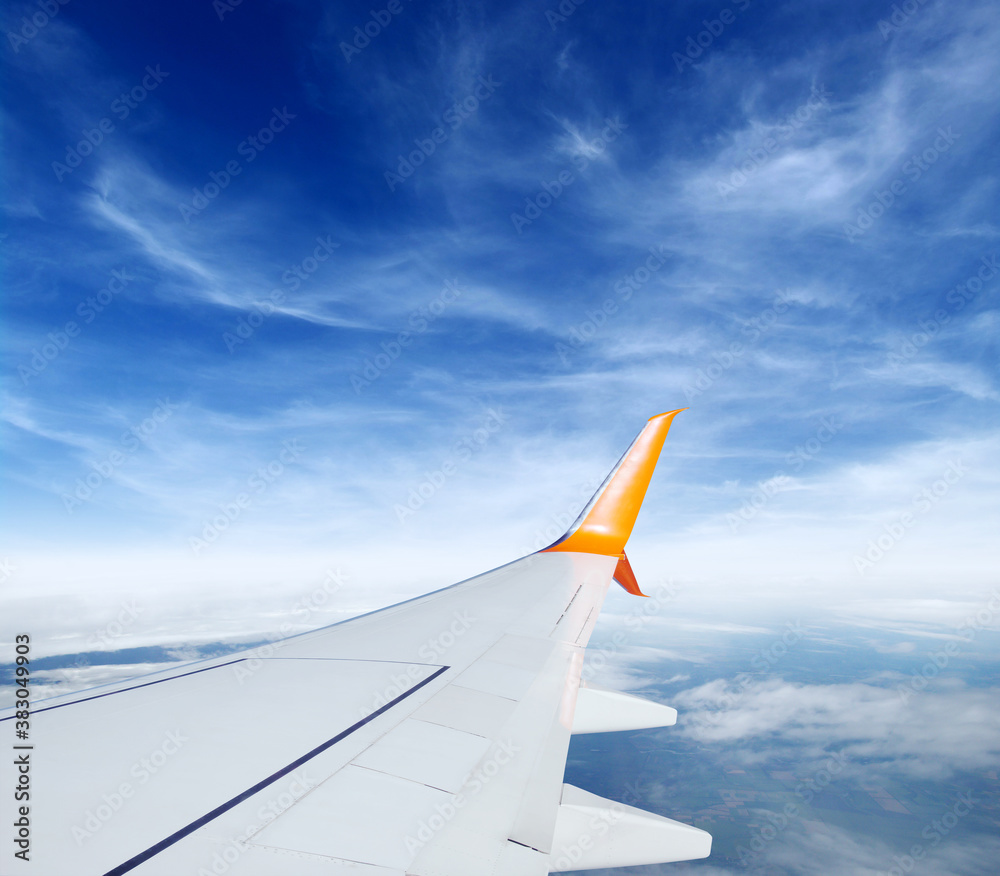 Wing of the plane on sky