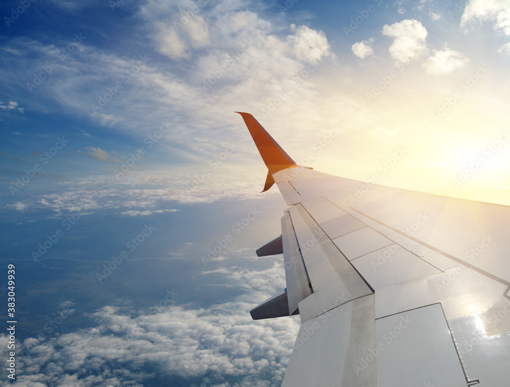 Wing of an airplane in the sunset