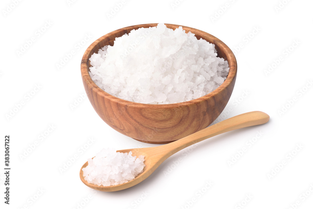 Natural sea salt in wooden bowl and spoon isolated on white background.