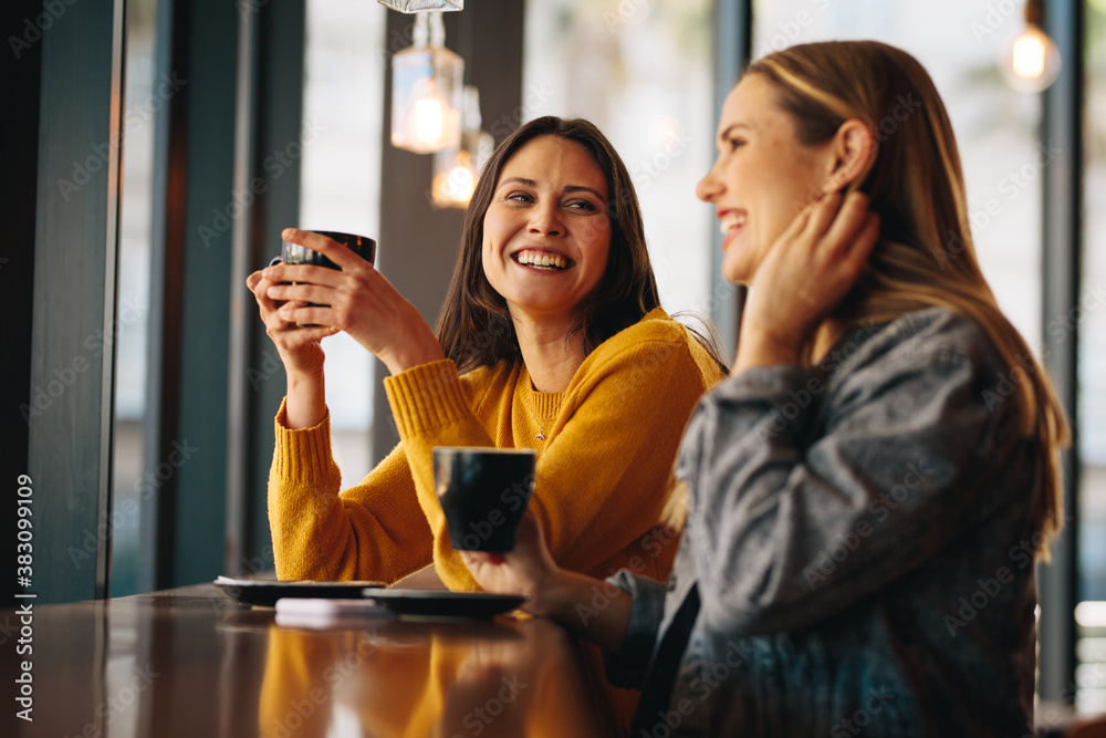 Friends meeting in coffee shop on a weekend