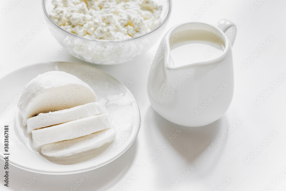 Fresh dairy products on white desk background