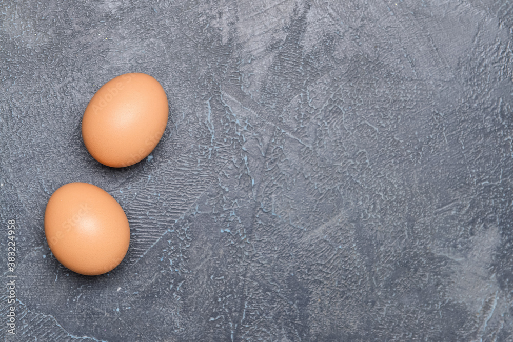 Tasty eggs on dark background