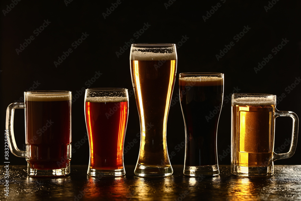 Glassware of fresh beer on table