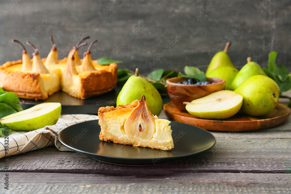 Plate with tasty pear cake on table