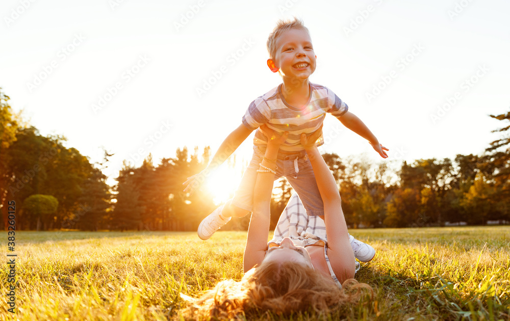 Happy family: mother and son in nature in summer.