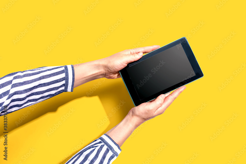 Woman using a tablet computer from above