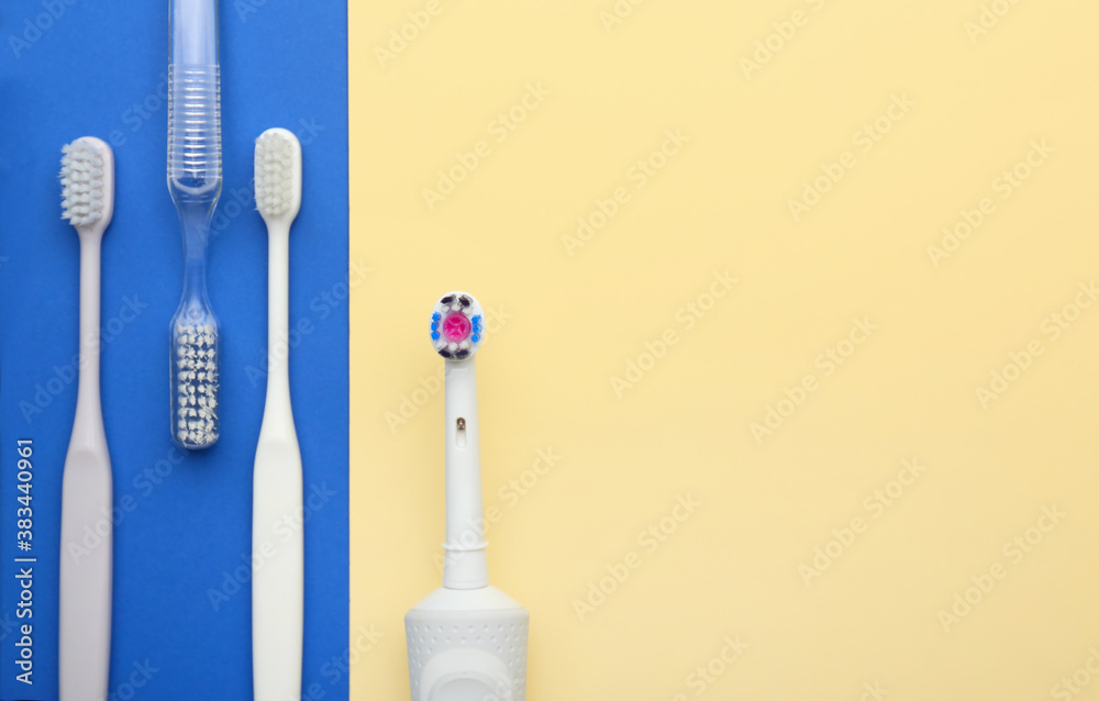 Tooth brushes on color background