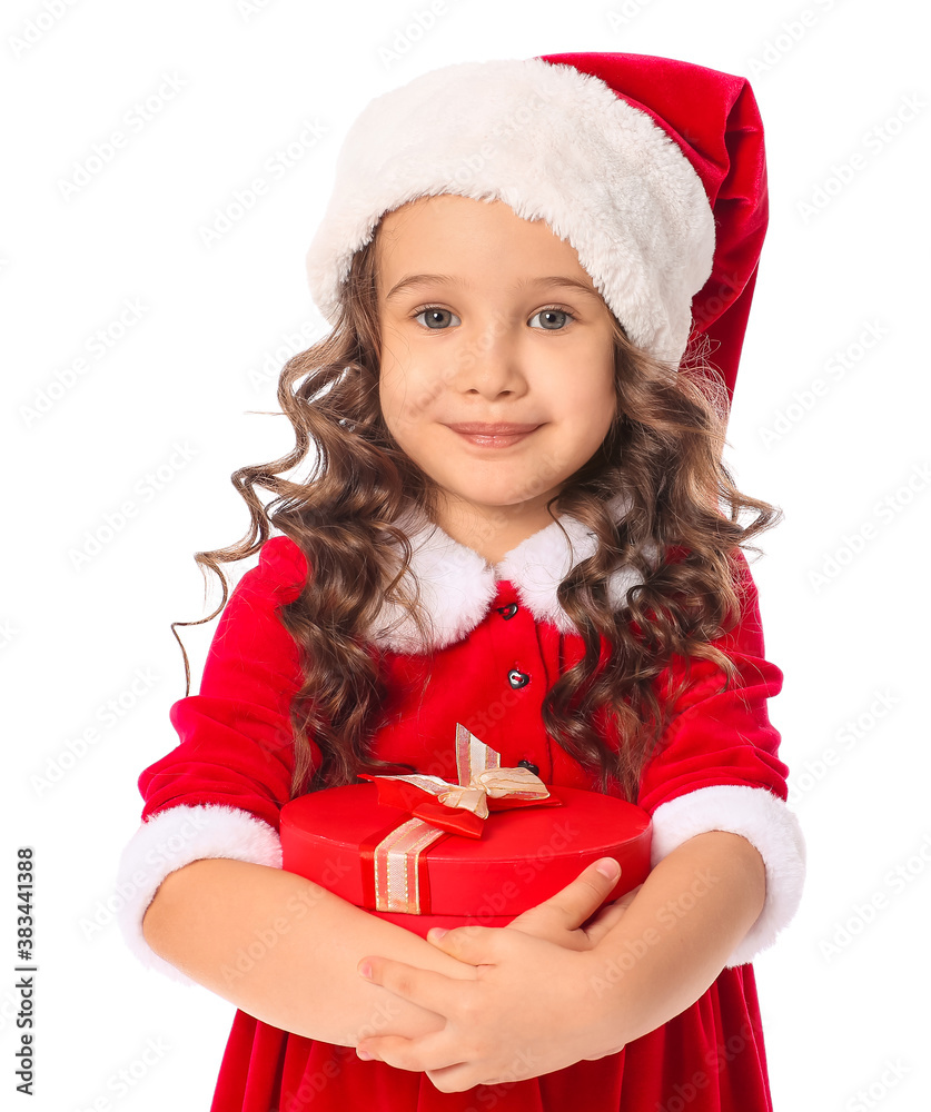 Cute little girl in Santa costume and with gift on white background