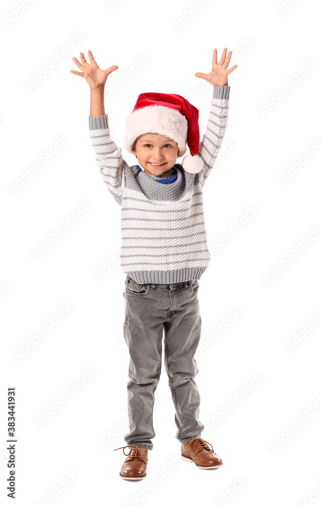 Cute little boy in Santa hat on white background