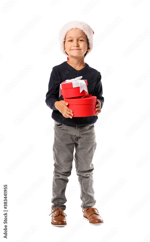 Cute little boy in Santa hat and with gift boxes on white background