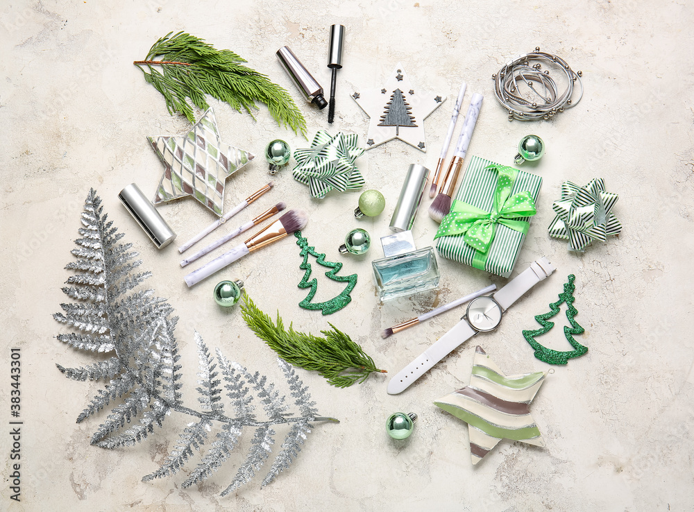 Christmas composition with cosmetics on light background