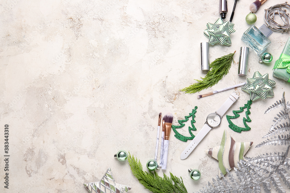 Christmas composition with cosmetics on light background