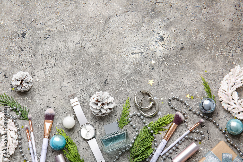 Christmas composition with cosmetics on grey background