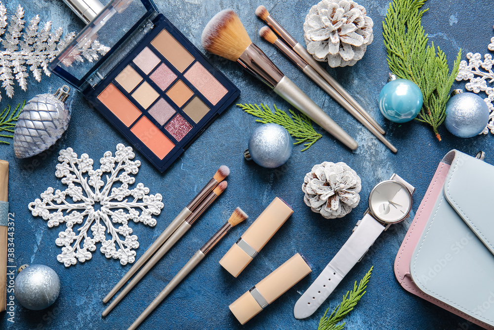 Christmas composition with cosmetics on color background