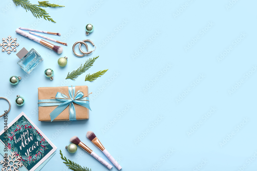 Christmas composition with cosmetics on color background