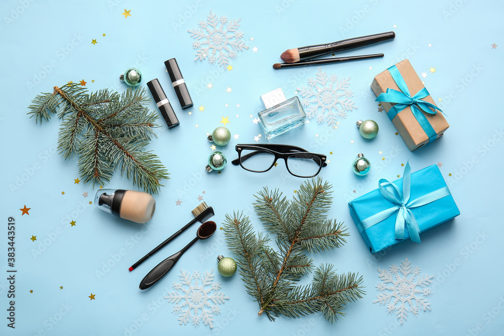 Christmas composition with cosmetics on color background