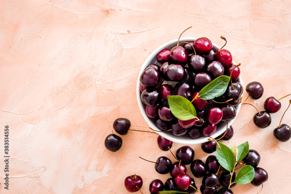 Berries in the bowl. Red cherry top view, copy space