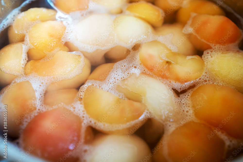 peeled boiled apples in a sugar syrup