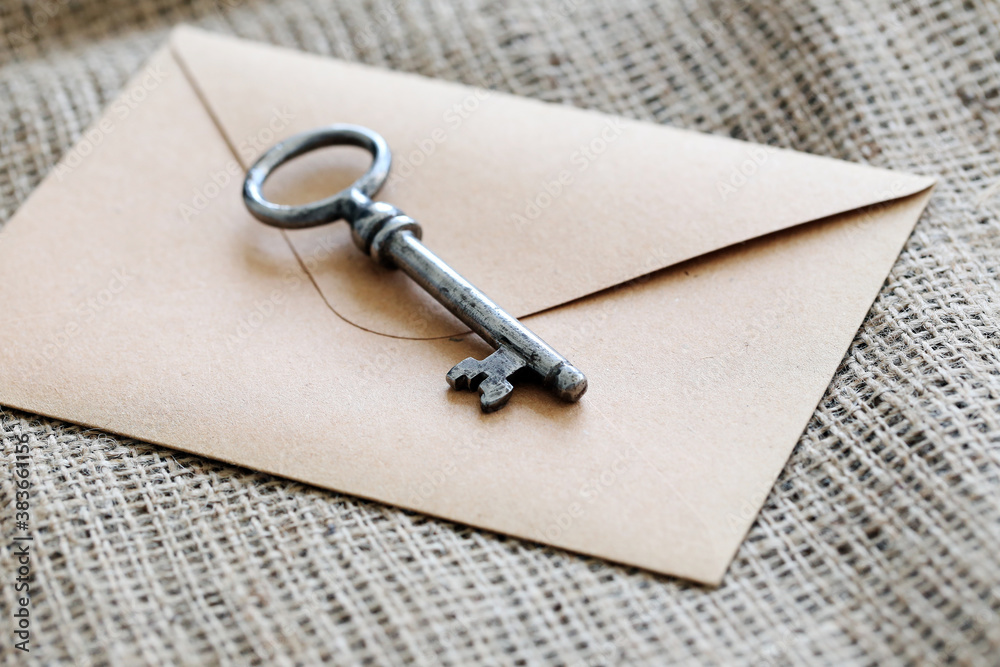 Old, ornate key with envelope