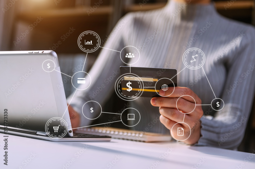 Close up of hand using tablet ,laptop, and holding mobile phone with credit card online banking paym