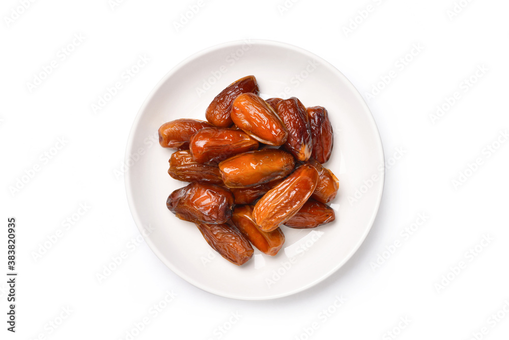 Top view of dried Date palm fruits in white plate isolate on white background with clipping path.