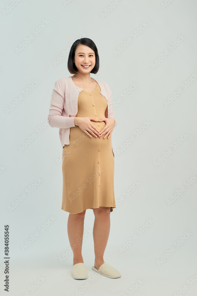 Pregnant woman on light background