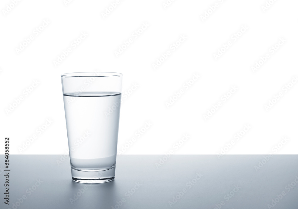 A clear glass of water on a white background