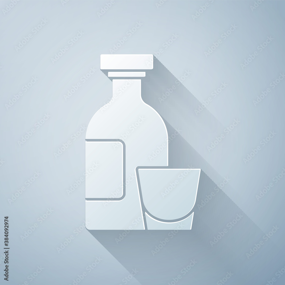 Paper cut Alcohol drink Rum bottle and glass icon isolated on grey background. Paper art style. Vect