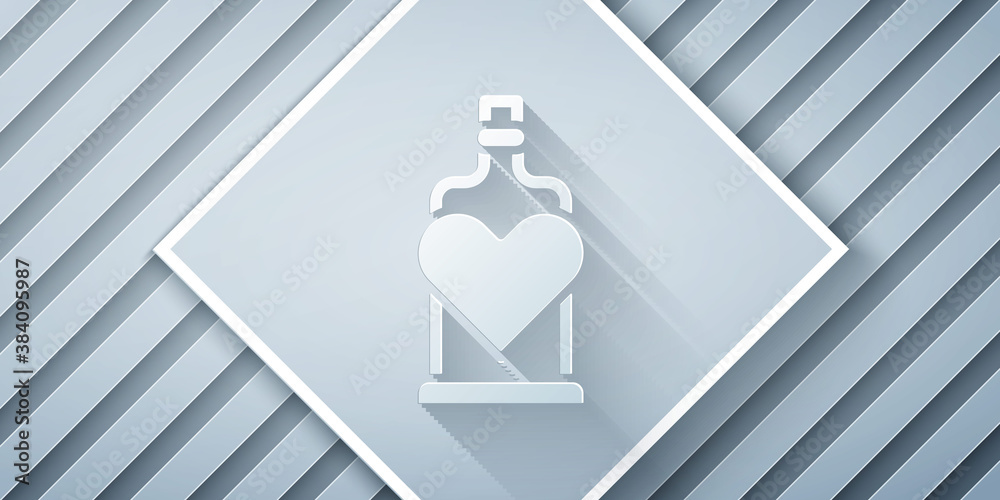 Paper cut Bottle with love potion icon isolated on grey background. Valentines day symbol. Paper art