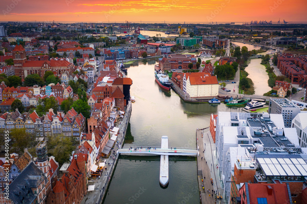 Aerial view of the Gdansk city over Motlawa river with amazing architecture at sunset,  Poland