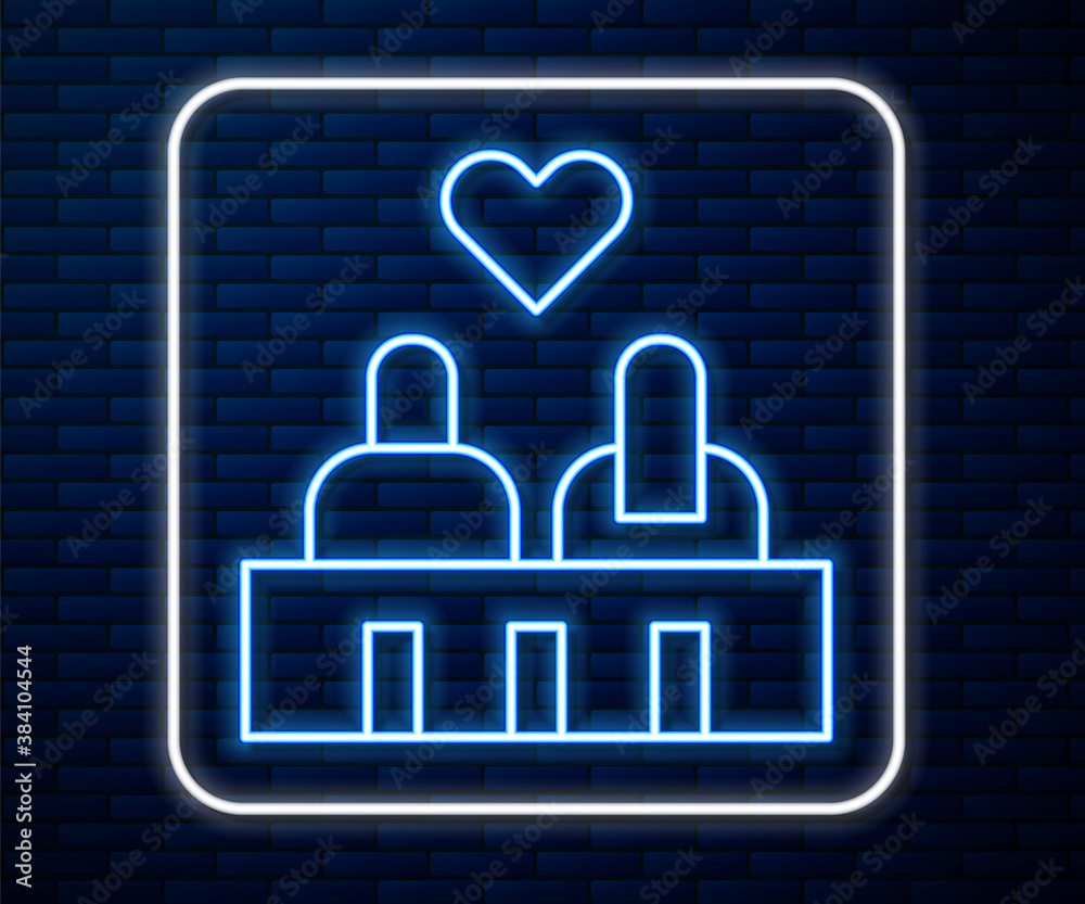 Glowing neon line Romantic silhouette of loving couple sit on a bench near icon isolated on brick wa