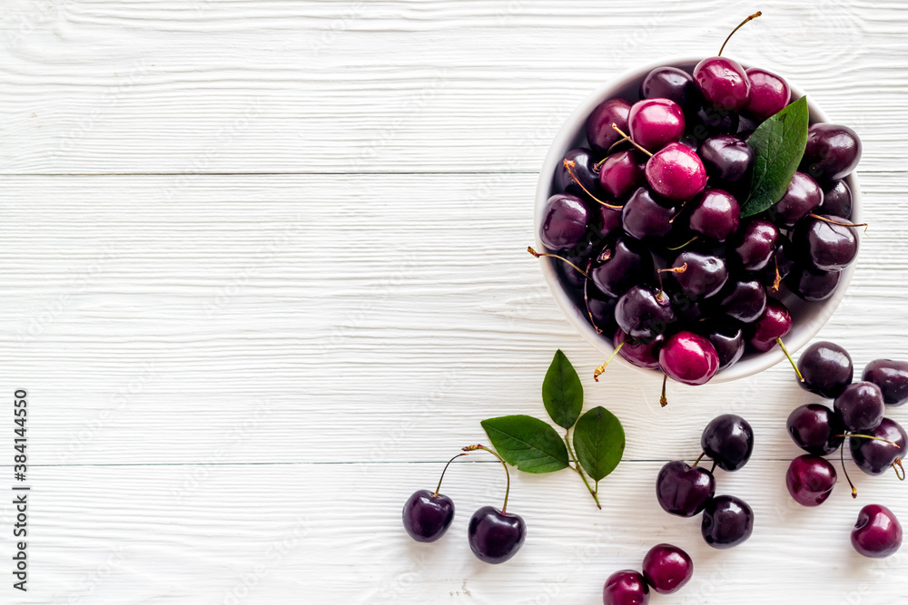 Sweet red cherries with leaves, flat lay, top view