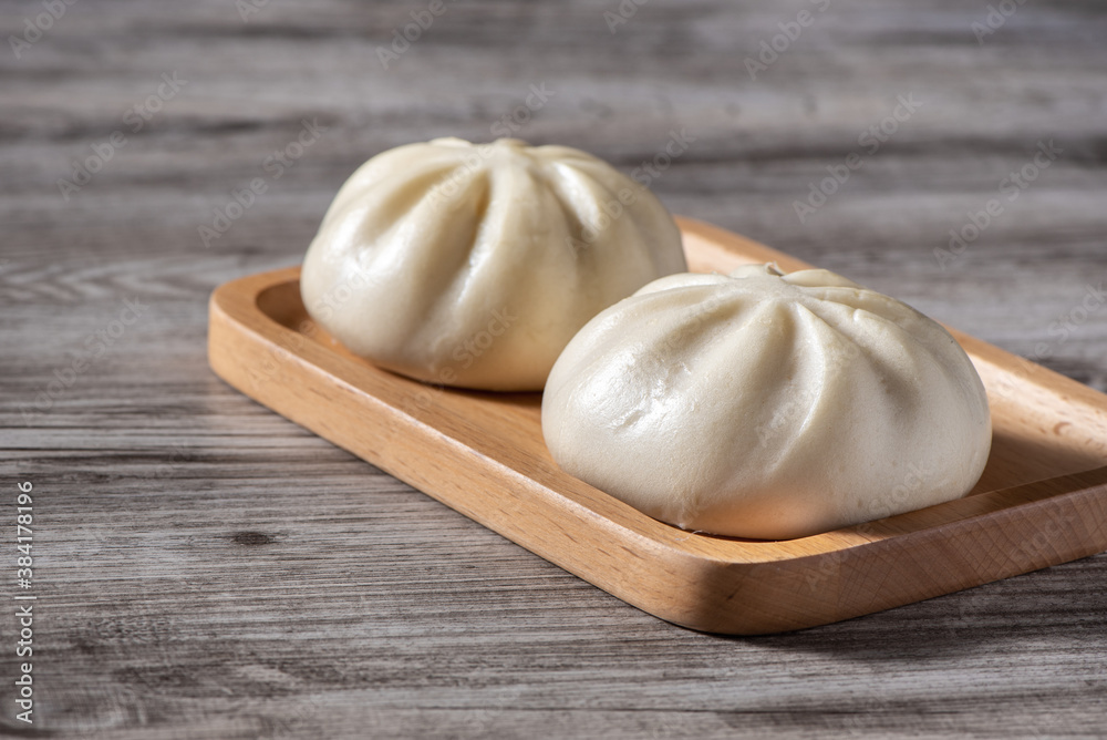 Close up of fresh delicious baozi, Chinese steamed meat bun.