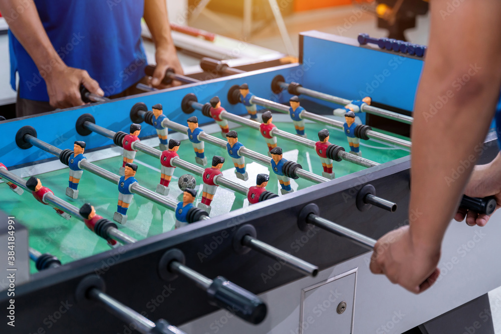 Office Workers Playing an Indoor Soccer World Cup Game During their Break Time to Relieve Stress In 