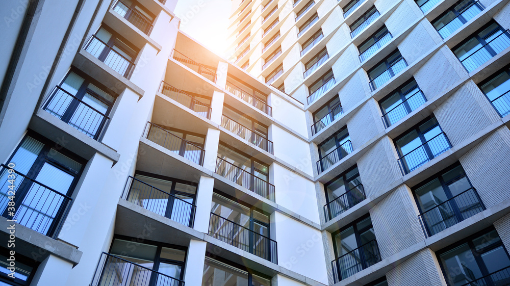 Apartment residential house and home facade architecture and outdoor facilities. Blue sky on the bac