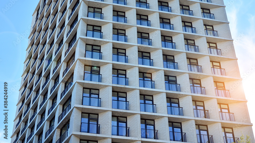 Apartment residential house and home facade architecture and outdoor facilities. Blue sky on the bac