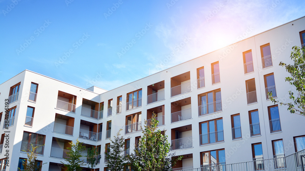 Apartment residential house and home facade architecture and outdoor facilities. Blue sky on the bac