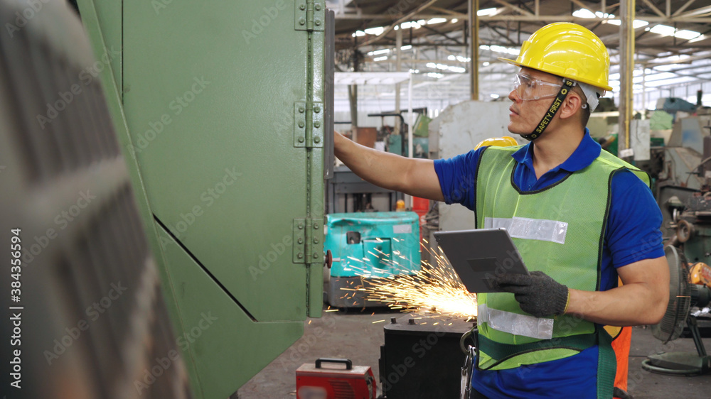 Smart factory worker using machine in factory workshop . Industry and engineering concept.