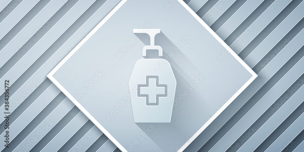 Paper cut Bottle of liquid antibacterial soap with dispenser icon isolated on grey background. Antis