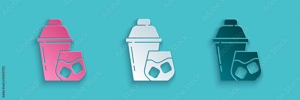 Paper cut Cocktail shaker with cocktail glass icon isolated on blue background. Paper art style. Vec