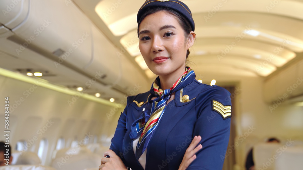 Cabin crew or air hostess working in airplane . Airline transportation and tourism concept.