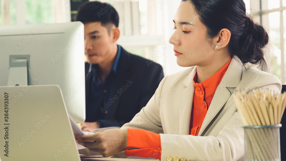 Business people working at table in modern office room while analyzing financial data report .