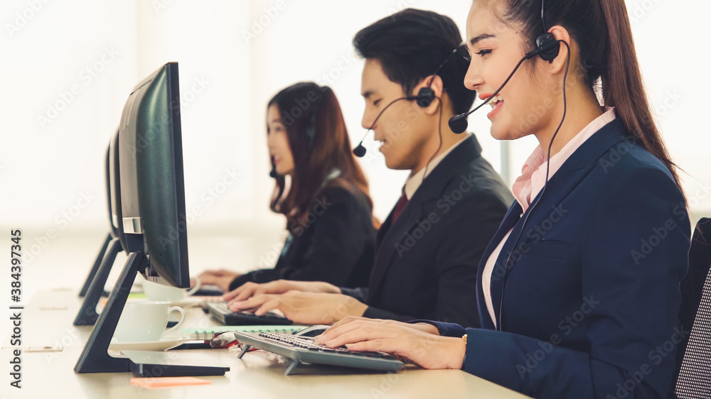 Business people wearing headset working in office to support remote customer or colleague. Call cent