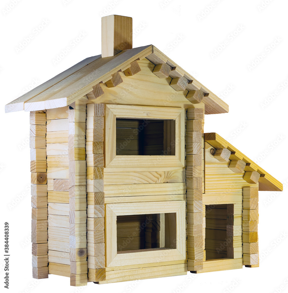 A rustic house made of wooden toy construction set with isolated background.