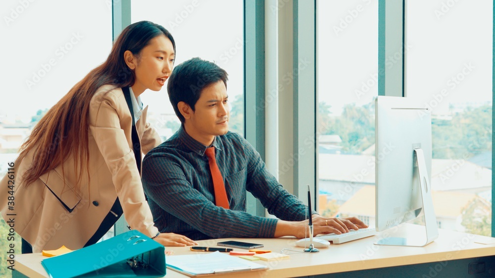 Two business people talk project strategy at office meeting room. Businessman discuss project planni