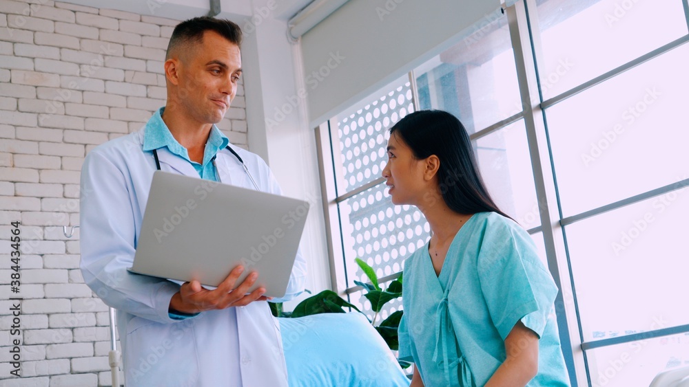 Doctor in professional uniform examining patient at hospital or medical clinic. Health care , medica